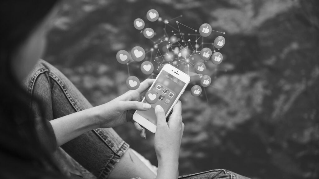 high-angle-woman-holding-smartphone