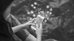 high-angle-woman-holding-smartphone