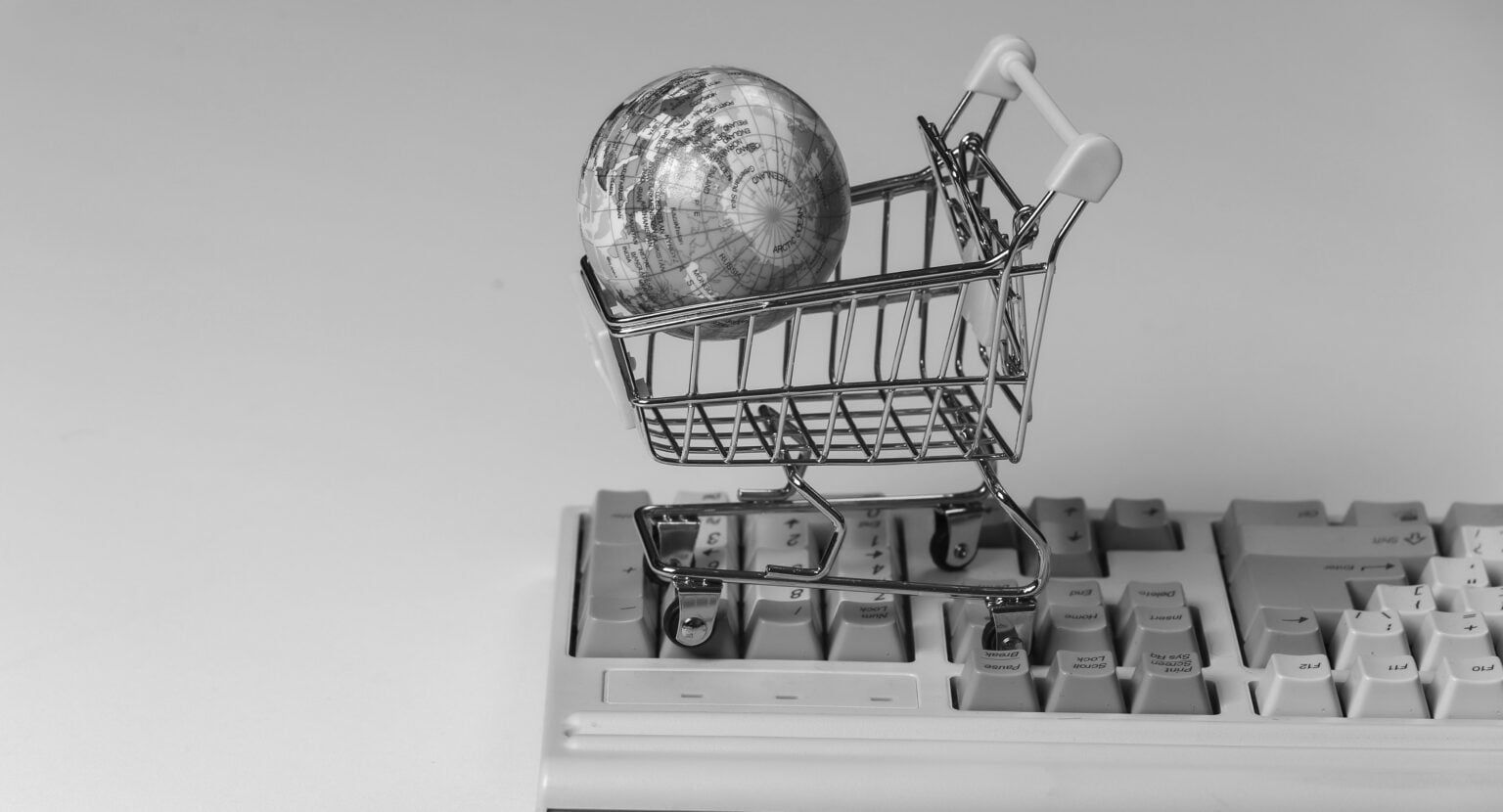 shopping-trolley-with-globe-old-pc-keyboard