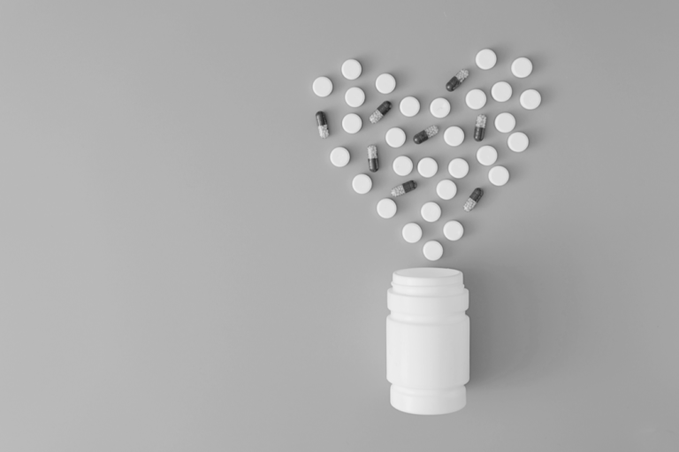 The picture shows pills in the shape of a heart.